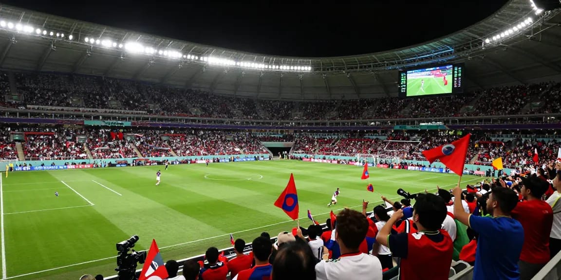 Exciting soccer match at World Cup with fans cheering, scores updated on https://bongdata.net/ in a vibrant stadium.